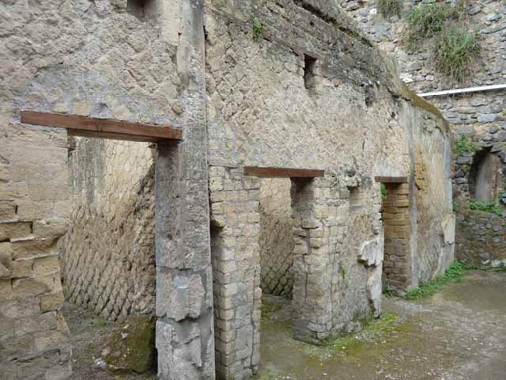 VII.2 Herculaneum. May 2010. Doorways on south side of peristyle area.